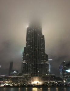 Burj Khalifa disappearing into the low flying rain clouds